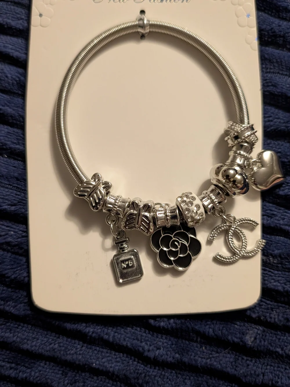 Silver Charm Bracelet with Floral and Heart Accents
